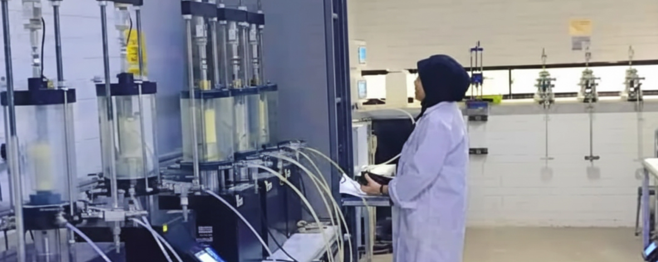 Soiltechnics Laboratory Technicians Conducting Tests